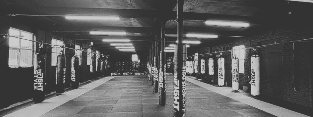 Rows of heavy bags inside the GFC Muay Thai gym