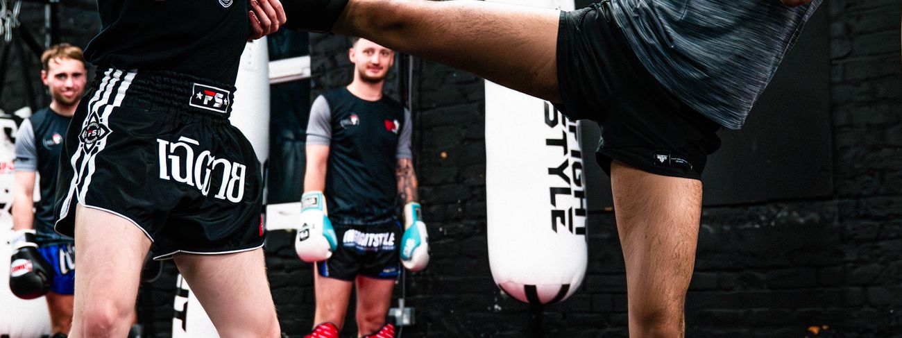 Luke Phillips coaching a push kick at GFC Muay Thai